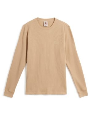 A beige long-sleeve waffle knit shirt with ribbed cuffs and a small embroidered Dandy Del Mar logo on the chest, known as The Cannes Long Sleeve Shirt in Truffle by Dandy Del Mar.