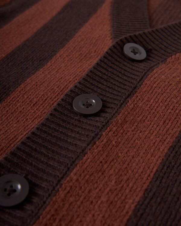 A close-up of The Florence Knit Cardigan in Garam by Dandy Del Mar, showcasing an elegant jacquard knit with brown and black stripes and black buttons along the front.