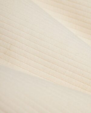 A close up image of the Dandy Del Mar Milan Rib Tank - Shell fabric.