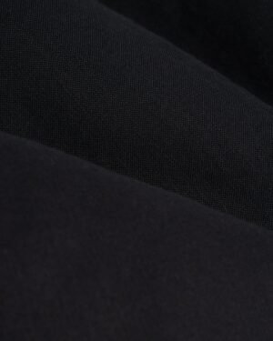 A close-up of the Dandy Del Mar Brisa Linen Trouser - Onyx.