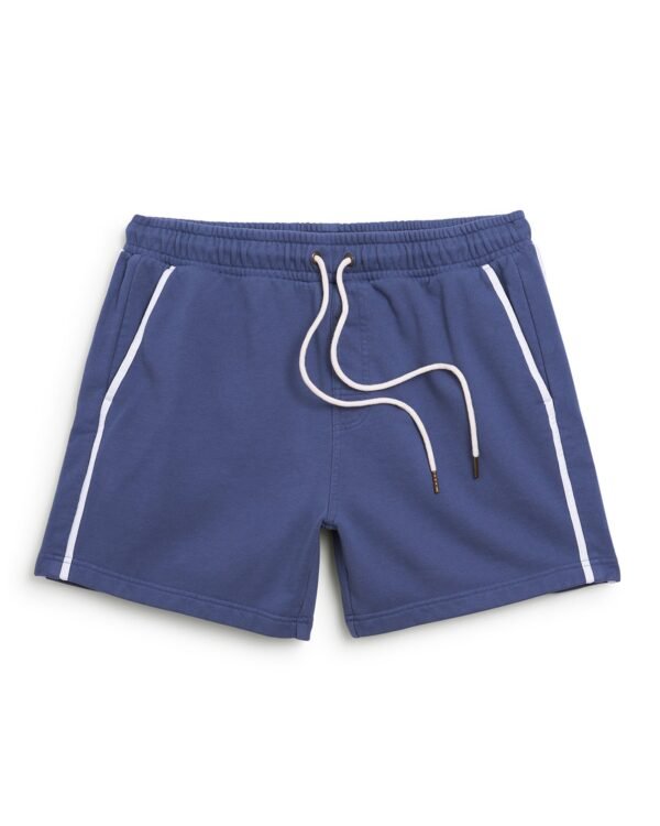 The Marseille French Terry Short - Moontide by Dandy Del Mar features blue athletic shorts with white side piping, an elastic waistband, white drawstrings, and a comfortable French terry fabric.