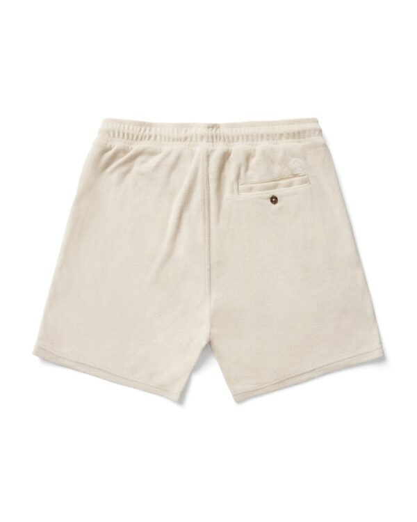 The Gaucho Shorts - Alabaster by Dandy Del Mar feature an Equatorial Cowboy aesthetic with soft terry cloth, an elastic waistband, and a buttoned single back pocket.