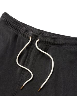 Close-up of The Gaucho Shorts - Onyx by Dandy Del Mar, featuring a dark gray terry cloth texture, white drawstrings with metallic tips, and detailed waistband design.