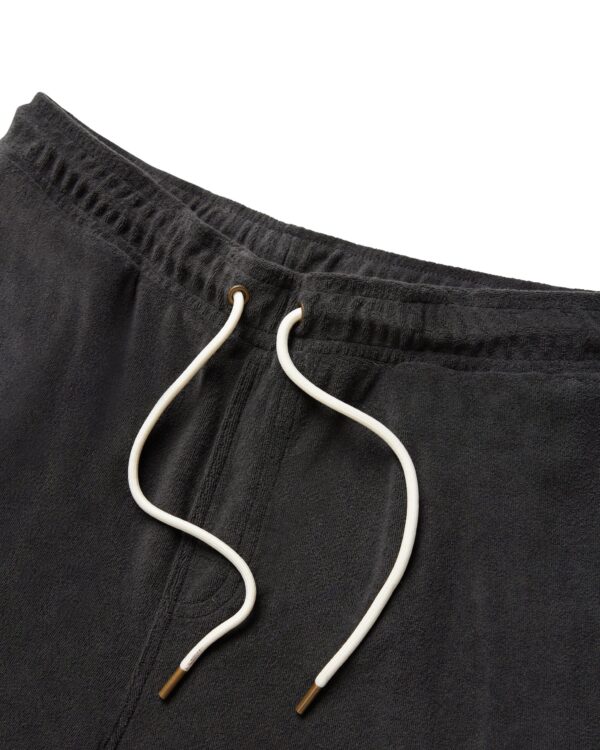 Close-up of The Gaucho Shorts - Onyx by Dandy Del Mar, featuring a dark gray terry cloth texture, white drawstrings with metallic tips, and detailed waistband design.